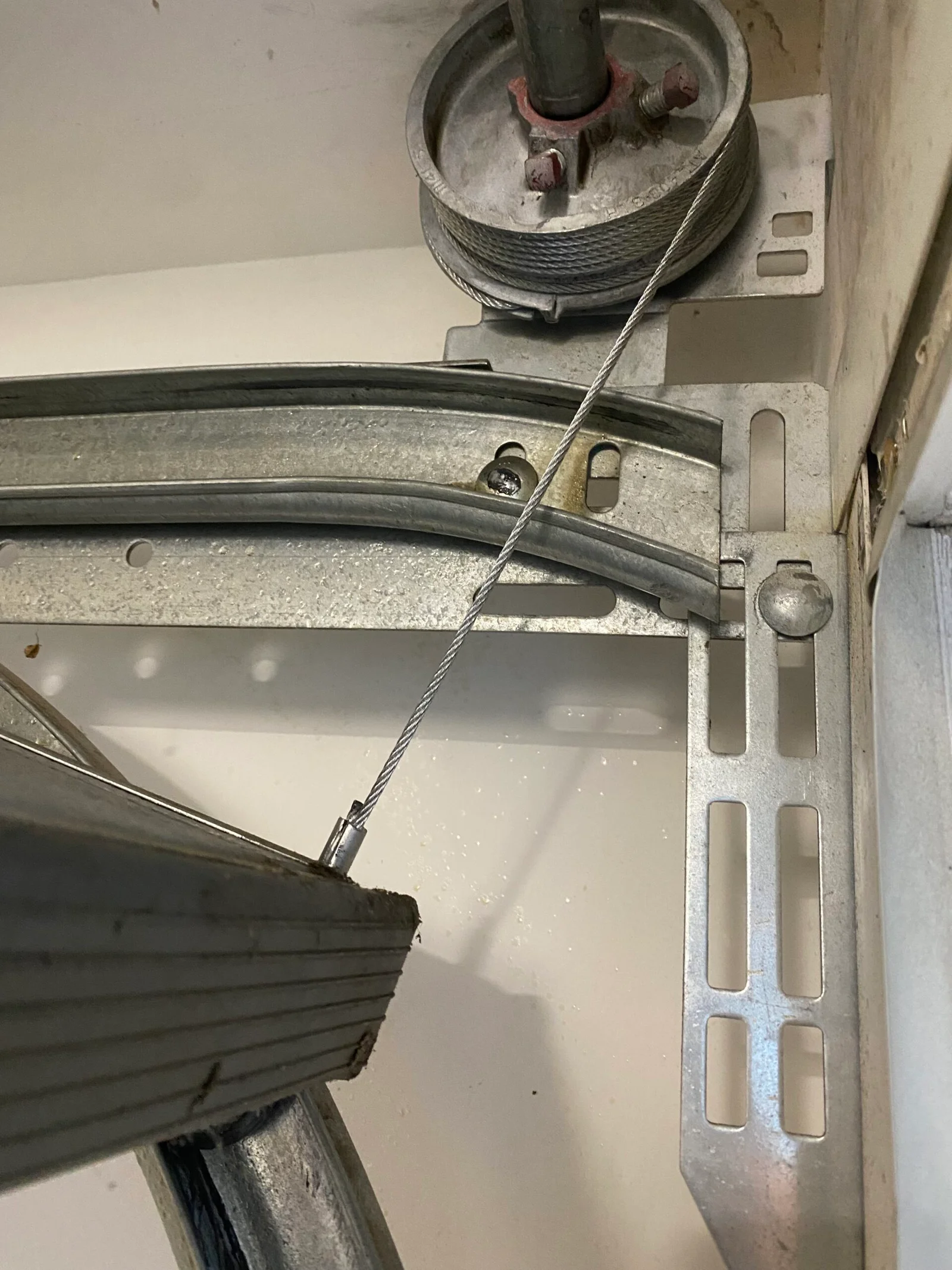 Garage door roller track and cable inspection for visible wear in Santa Clarita